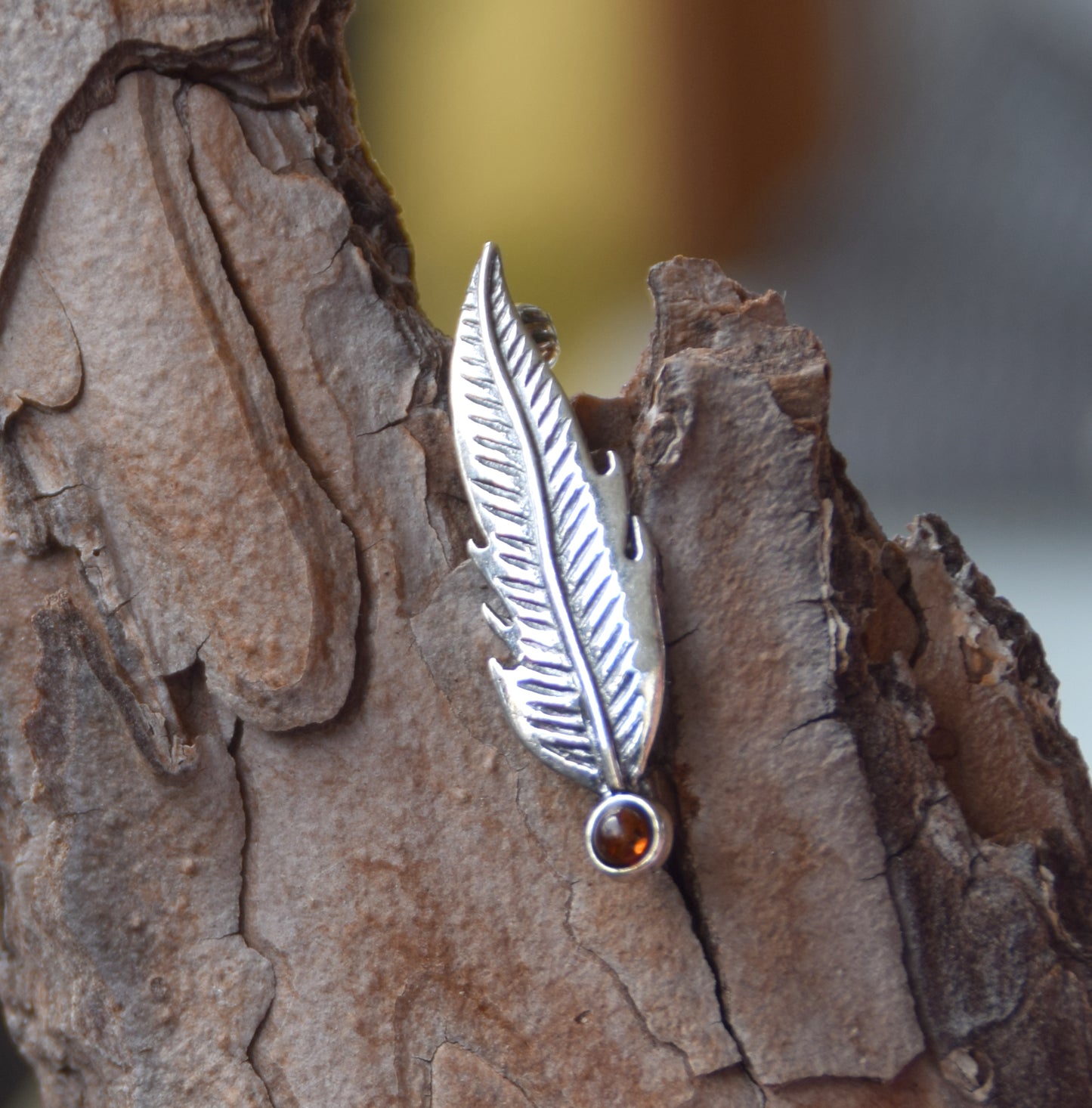 Delicate feather brooch made with natural cognac-colored amber and 925 silver, MJ Baltica, BBR050