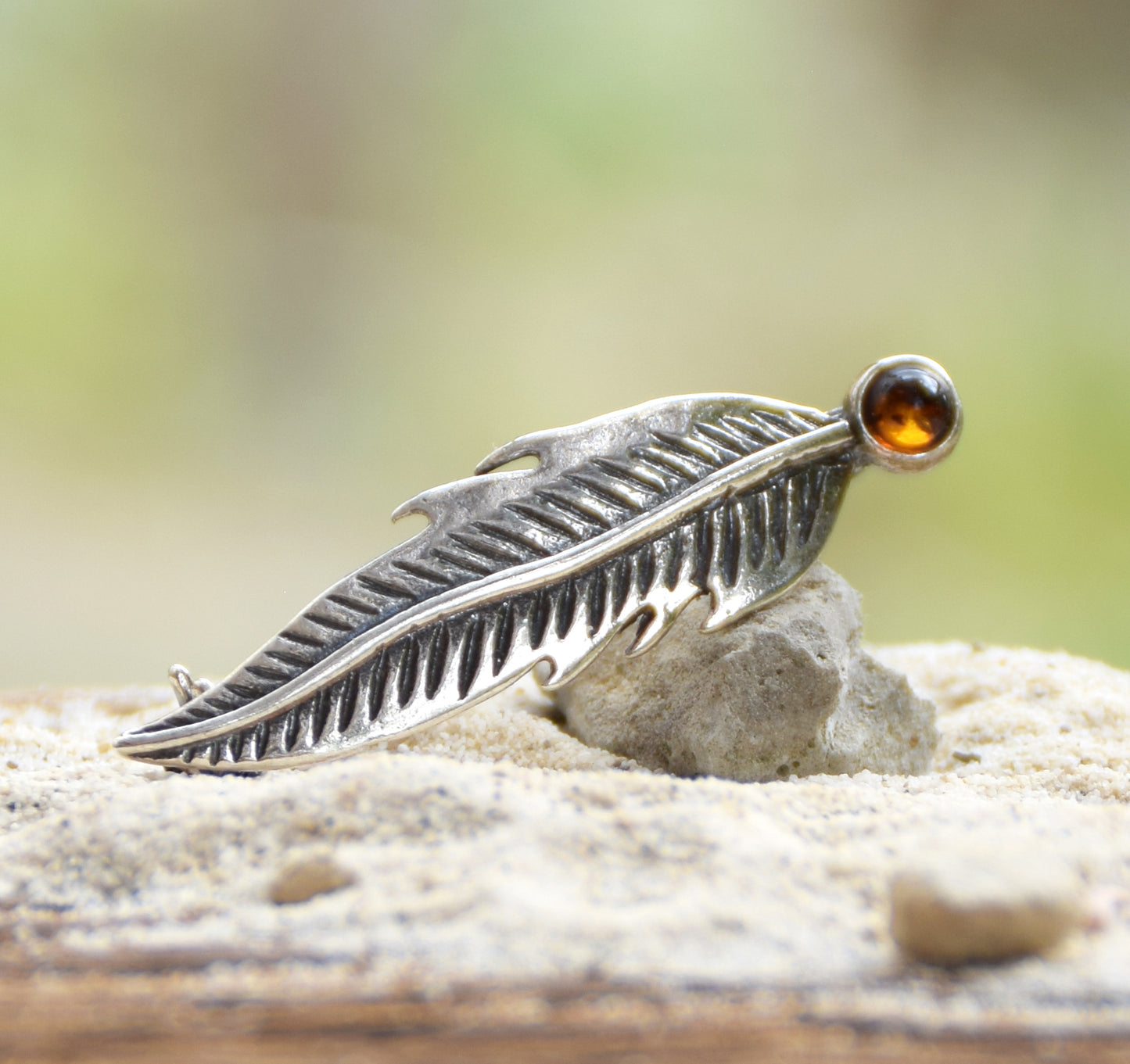 Delicate feather brooch made with natural cognac-colored amber and 925 silver, MJ Baltica, BBR050