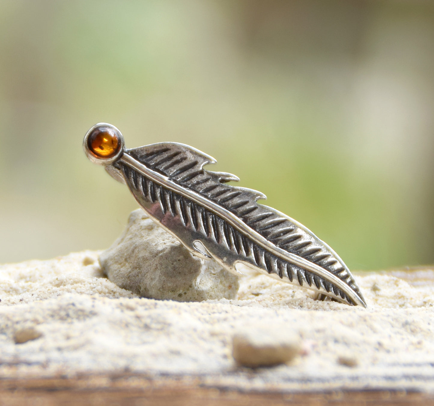 Delicate feather brooch made with natural cognac-colored amber and 925 silver, MJ Baltica, BBR050