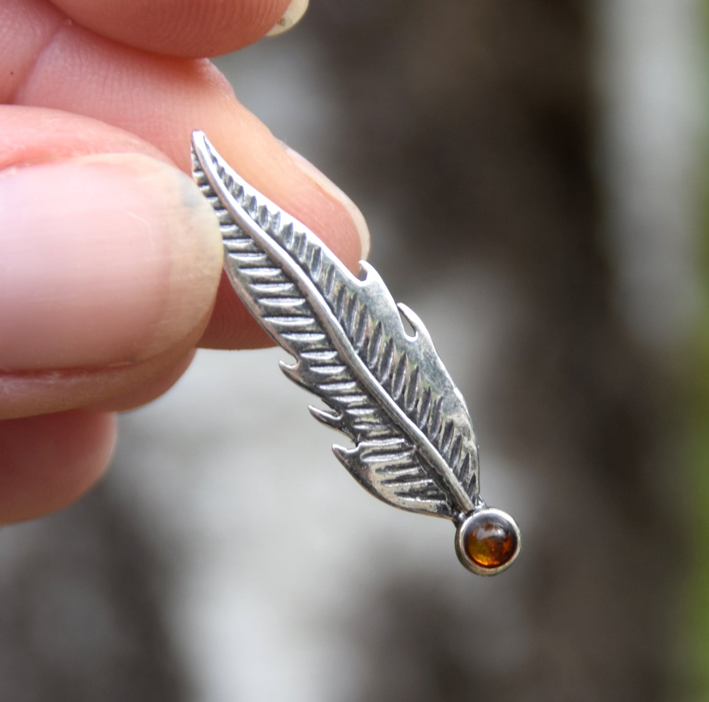 Delicate feather brooch made with natural cognac-colored amber and 925 silver, MJ Baltica, BBR050