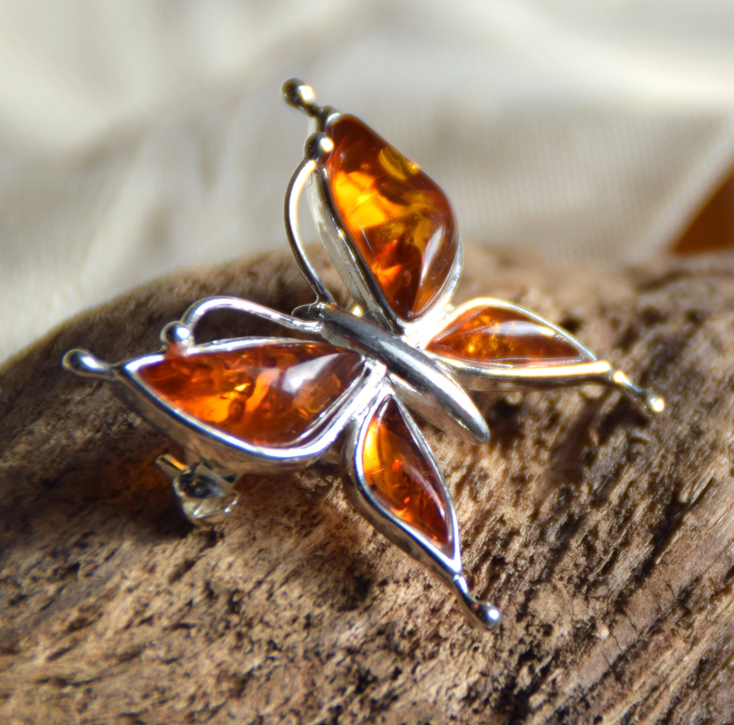 Bright butterfly brooch made with natural cognac Amber and 925 Silver, MJ Baltica, BBR056