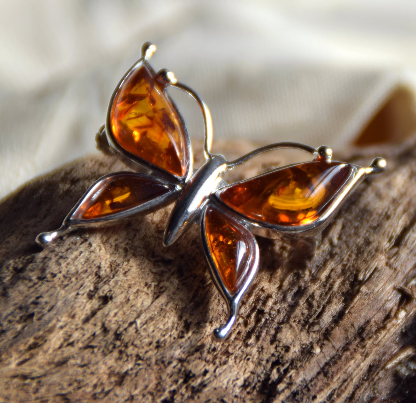Bright butterfly brooch made with natural cognac Amber and 925 Silver, MJ Baltica, BBR056