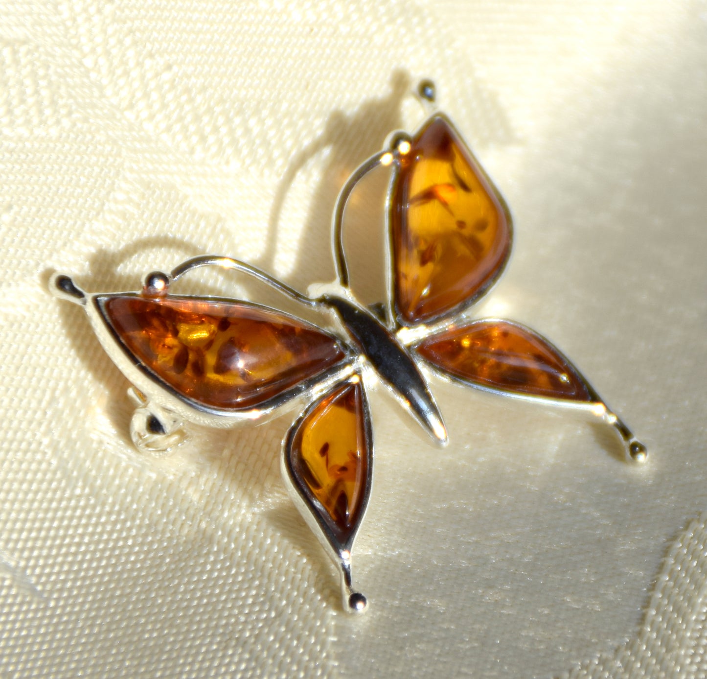 Bright butterfly brooch made with natural cognac Amber and 925 Silver, MJ Baltica, BBR056