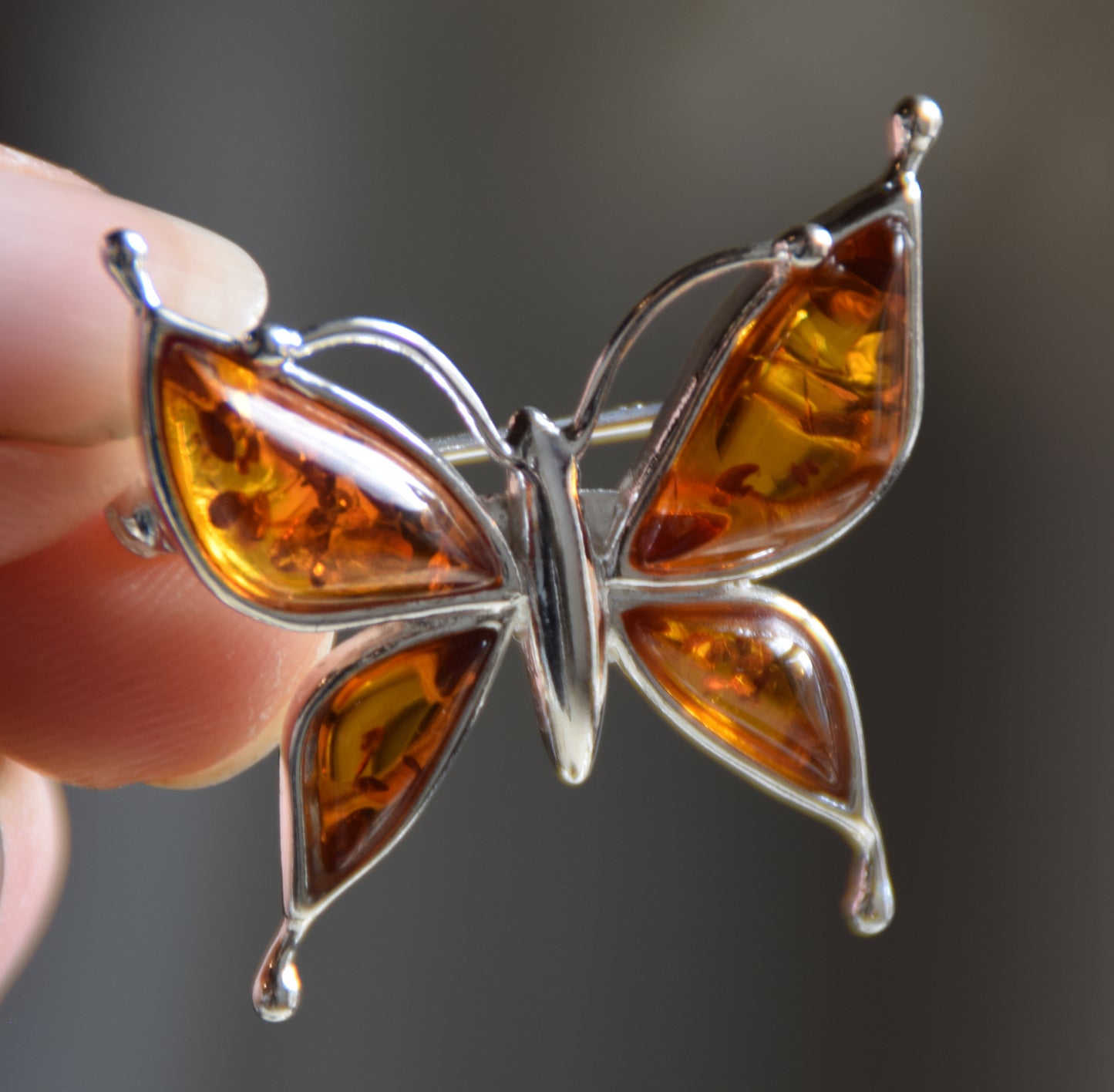 Bright butterfly brooch made with natural cognac Amber and 925 Silver, MJ Baltica, BBR056