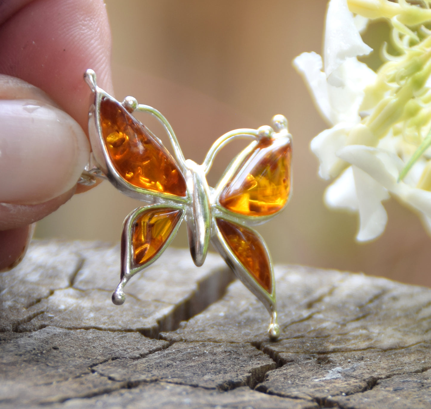 Bright butterfly brooch made with natural cognac Amber and 925 Silver, MJ Baltica, BBR056