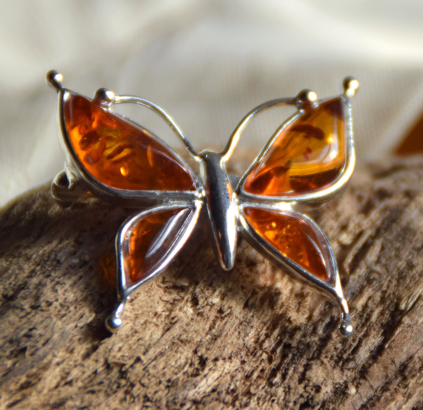 Bright butterfly brooch made with natural cognac Amber and 925 Silver, MJ Baltica, BBR056