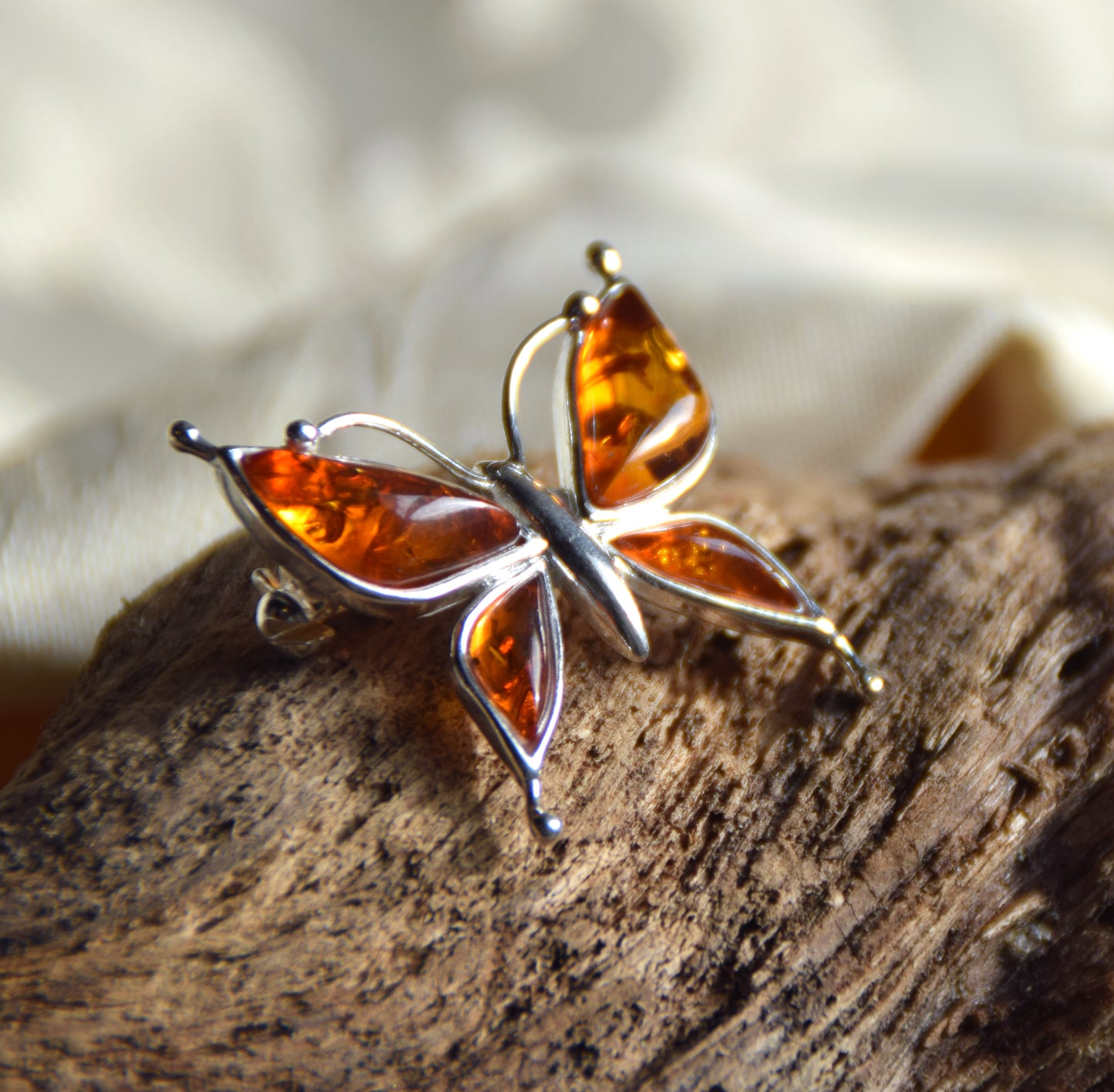 Bright butterfly brooch made with natural cognac Amber and 925 Silver, MJ Baltica, BBR056