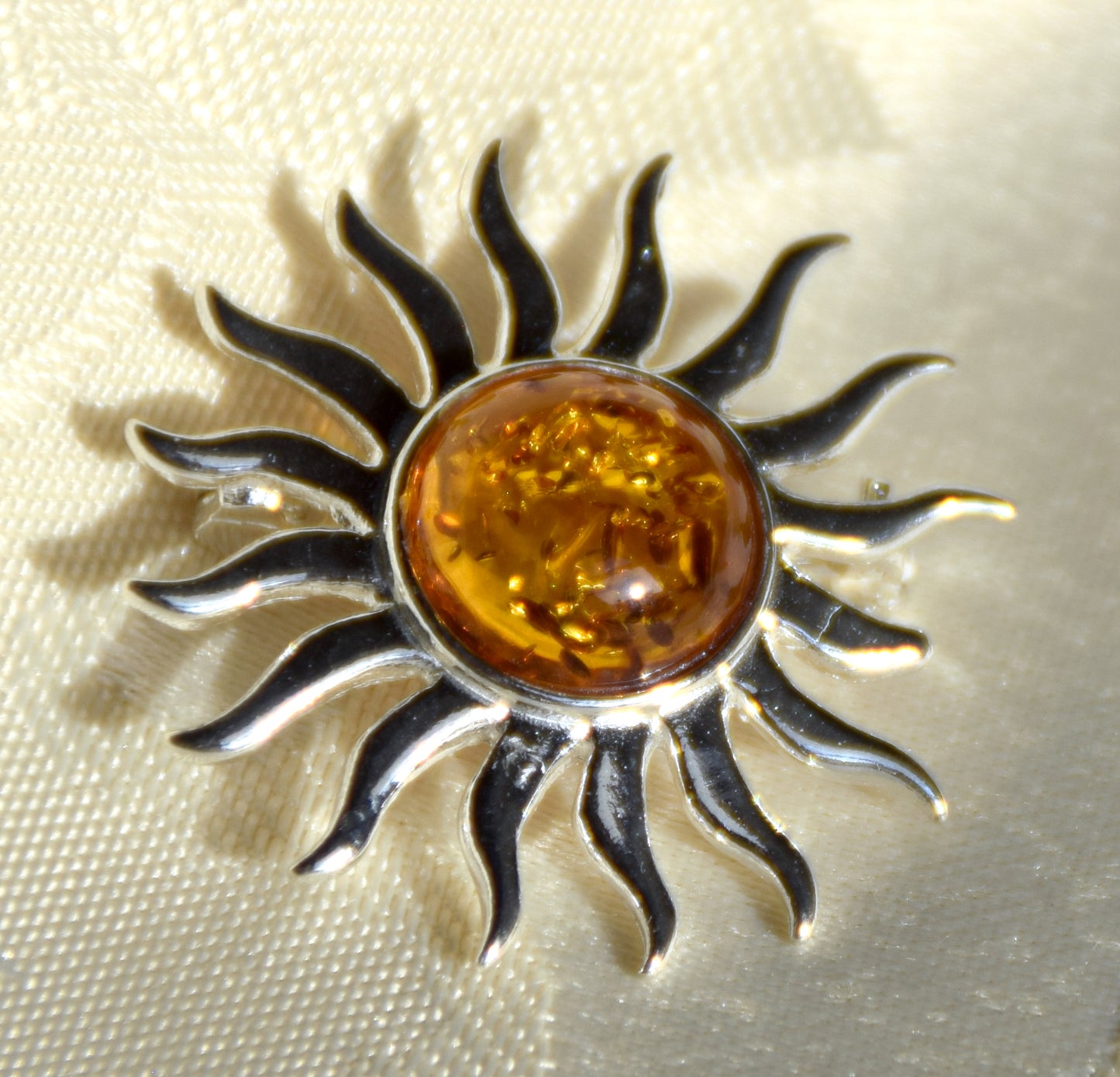 Bright sun-shaped brooch made with natural cognac-colored Amber and 925 Silver, MJ Baltica, BBR057