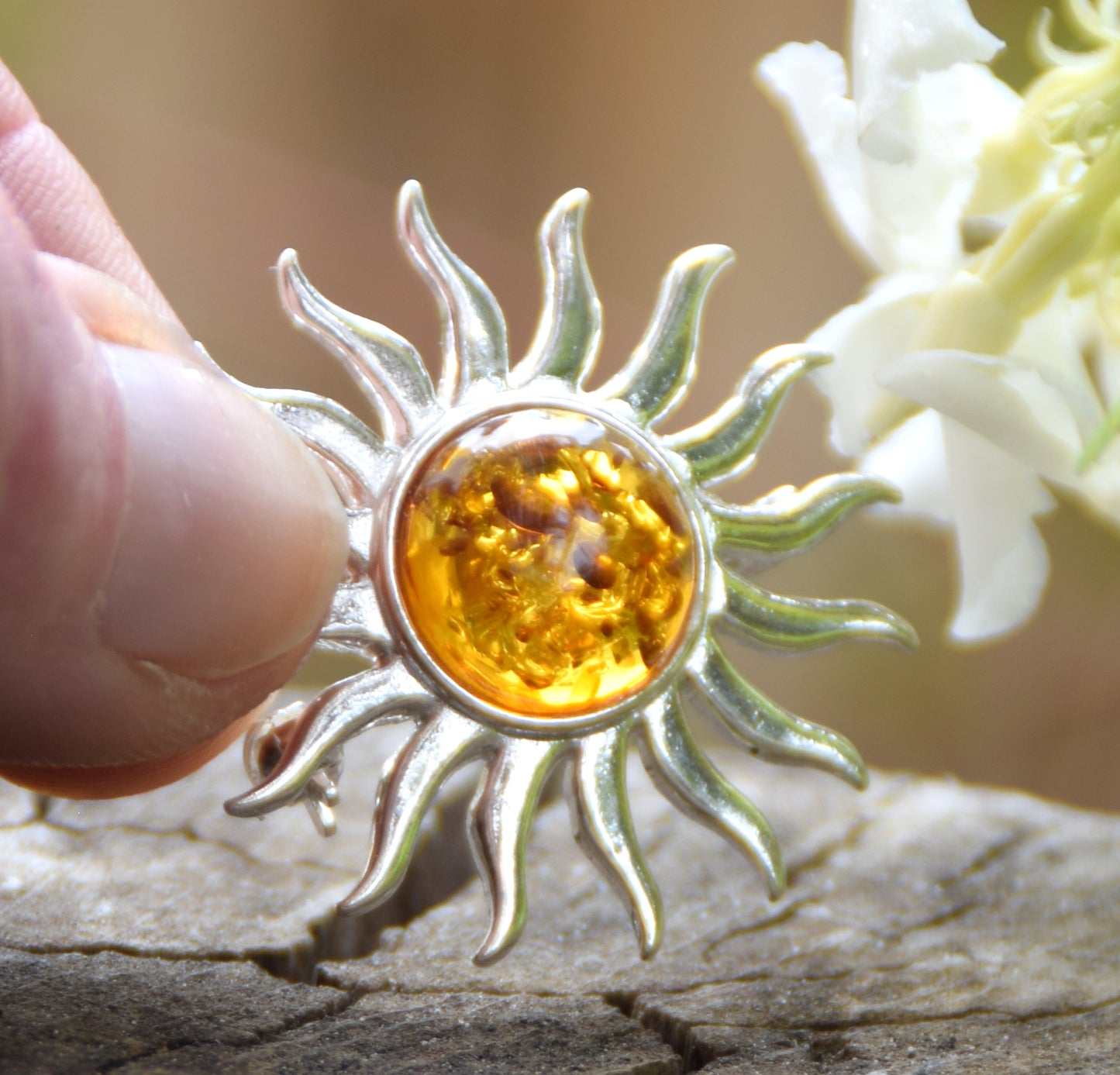 Bright sun-shaped brooch made with natural cognac-colored Amber and 925 Silver, MJ Baltica, BBR057