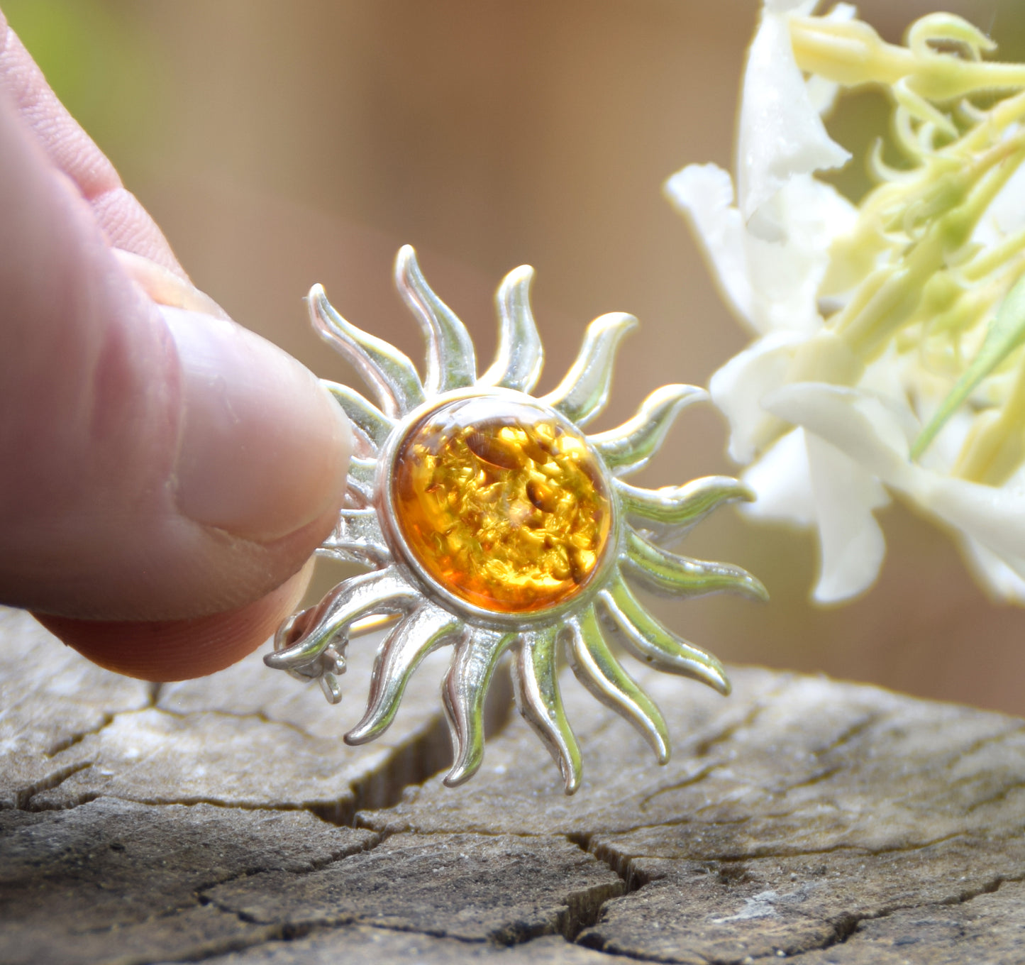 Bright sun-shaped brooch made with natural cognac-colored Amber and 925 Silver, MJ Baltica, BBR057