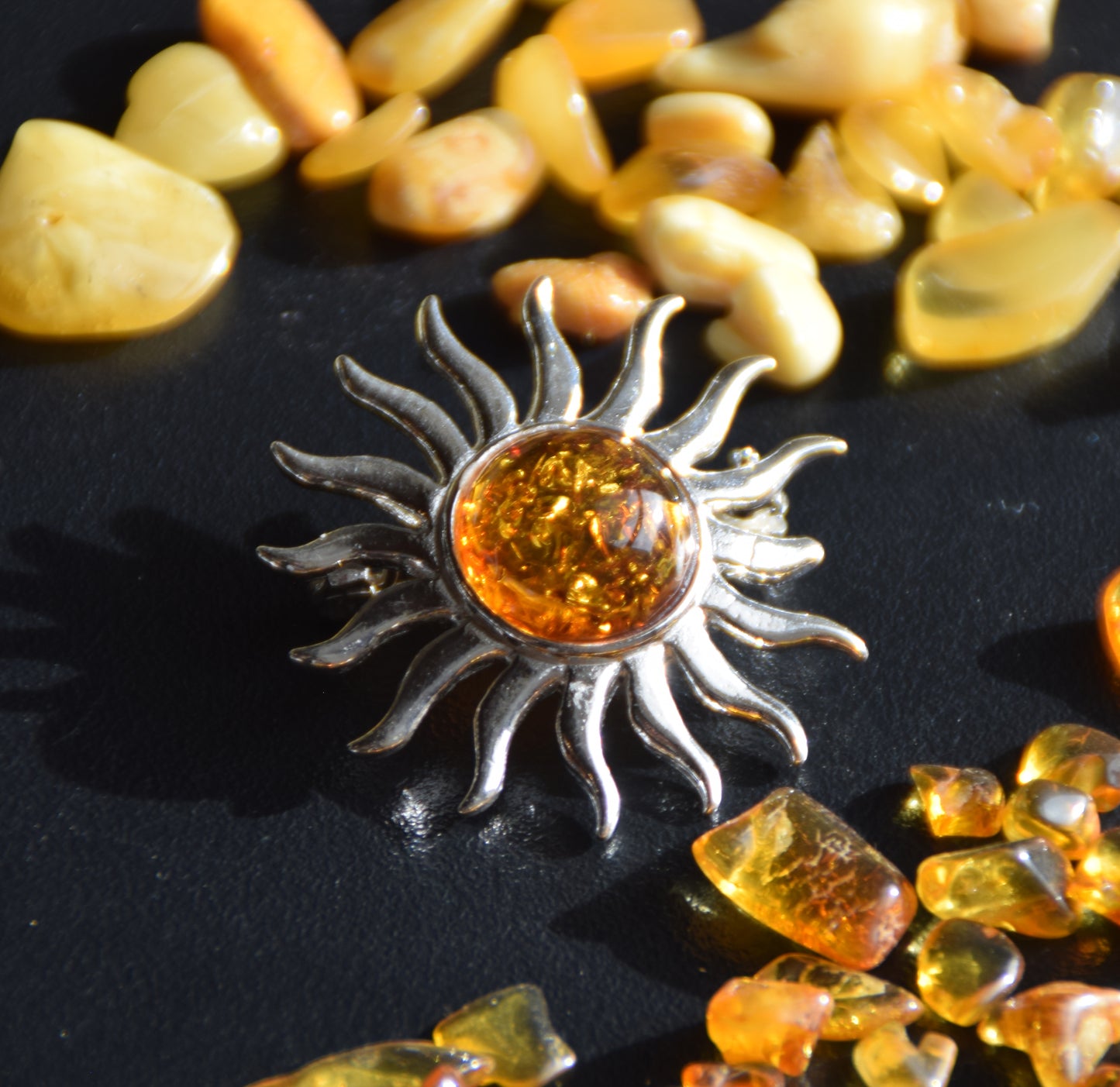 Bright sun-shaped brooch made with natural cognac-colored Amber and 925 Silver, MJ Baltica, BBR057