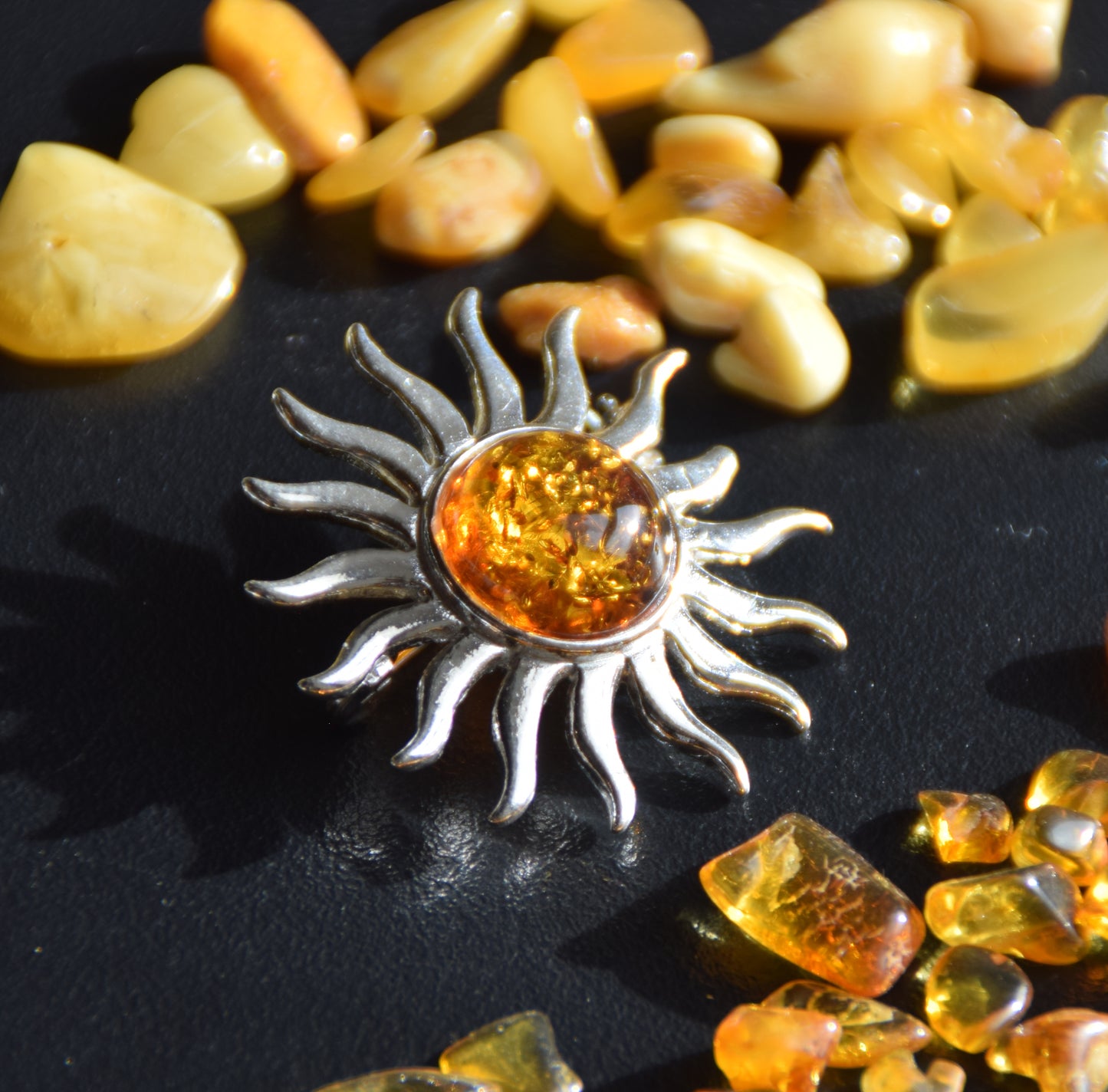 Bright sun-shaped brooch made with natural cognac-colored Amber and 925 Silver, MJ Baltica, BBR057