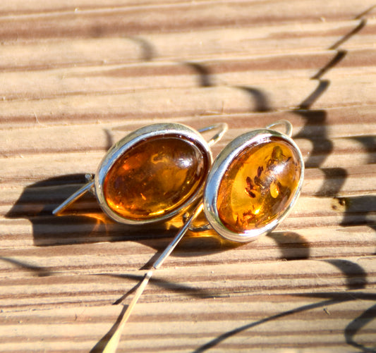 Bright earrings with a leverback closure, made with natural cognac-colored oval Amber and 925 Silver, MJ Baltica, BK047