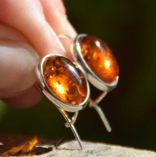 Bright earrings with a leverback closure, made with natural cognac-colored oval Amber and 925 Silver, MJ Baltica, BK047