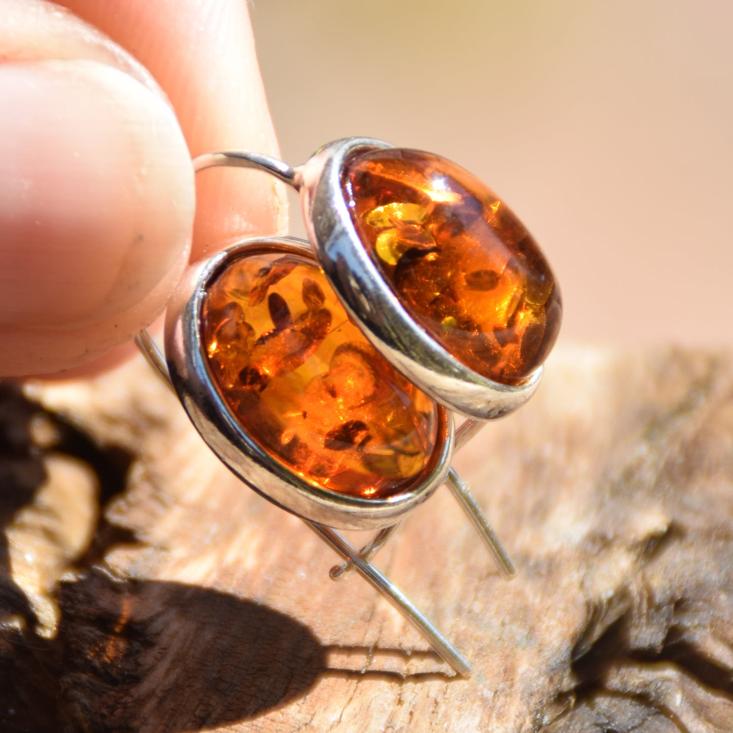 Bright earrings with a leverback closure, made with natural cognac-colored oval Amber and 925 Silver, MJ Baltica, BK047