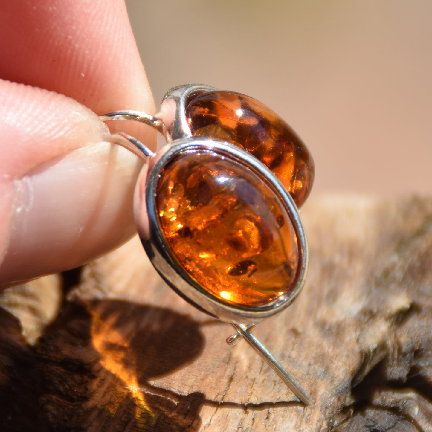 Bright earrings with a leverback closure, made with natural cognac-colored oval Amber and 925 Silver, MJ Baltica, BK047