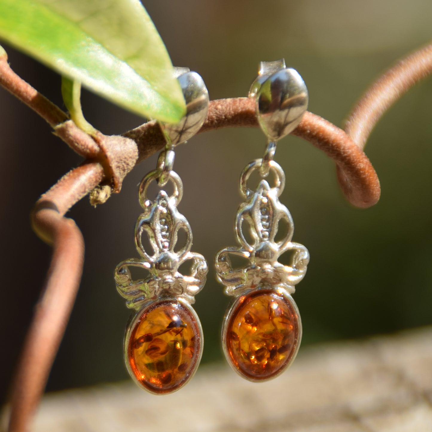 Delicate bow earrings made with cognac-colored natural Amber and 925 Sterling Silver, MJ Baltica, BK170