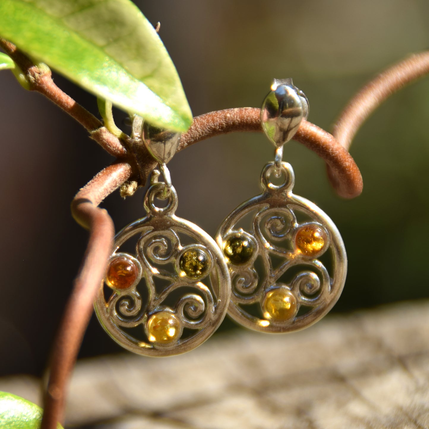 Dangle earrings with triskelion symbol made with natural Amber of various shades and 925 Sterling Silver, MJ Baltica, BK171