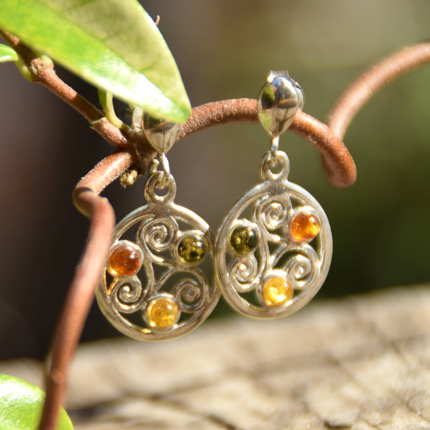 Dangle earrings with triskelion symbol made with natural Amber of various shades and 925 Sterling Silver, MJ Baltica, BK171
