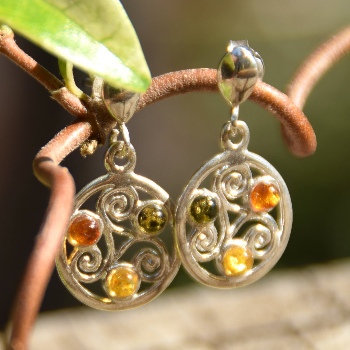 Dangle earrings with triskelion symbol made with natural Amber of various shades and 925 Sterling Silver, MJ Baltica, BK171