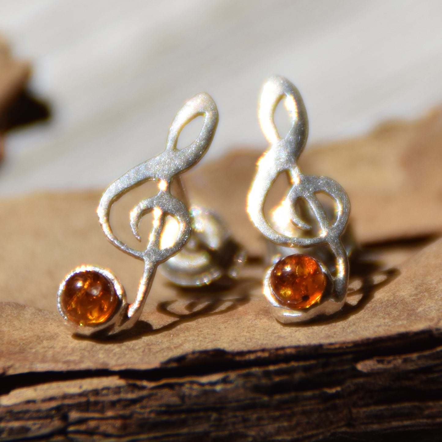 Delicate stud earrings with a musical note in natural cognac amber and 925 Silver, MJ Baltica, BK191