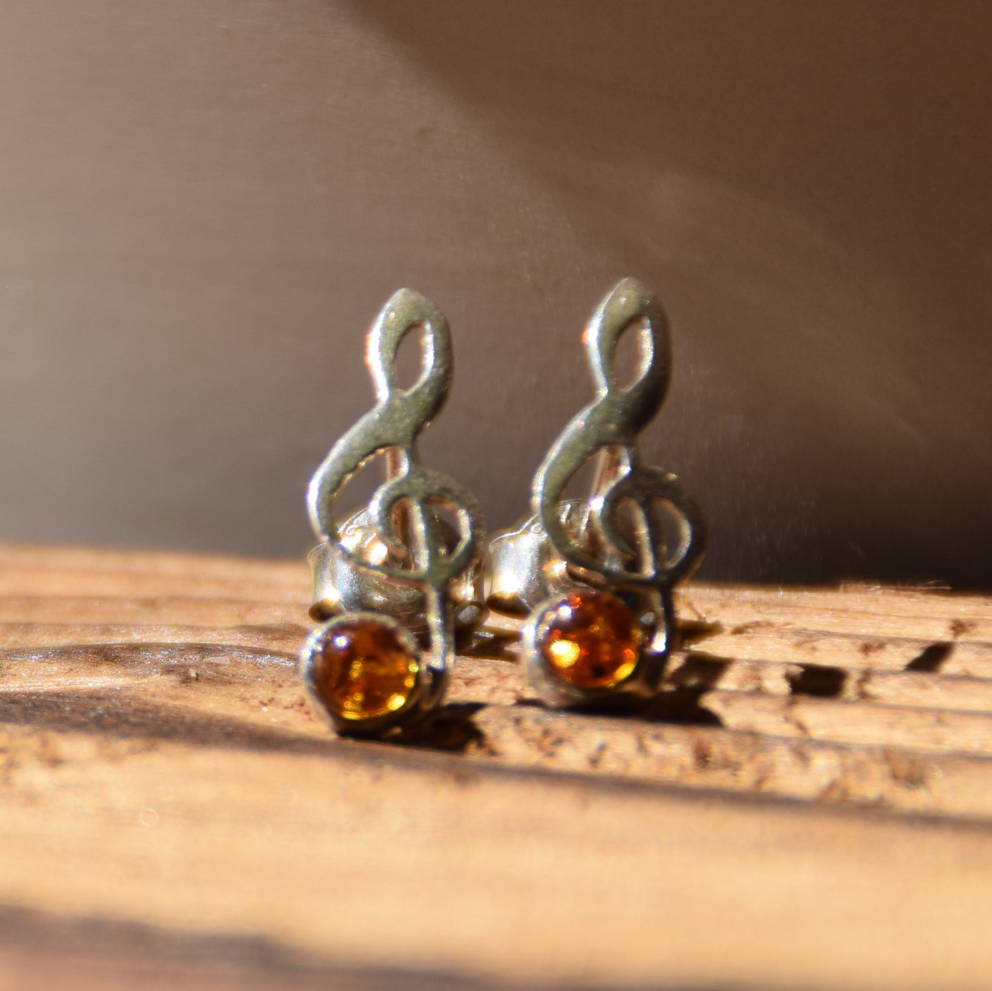 Delicate stud earrings with a musical note in natural cognac amber and 925 Silver, MJ Baltica, BK191