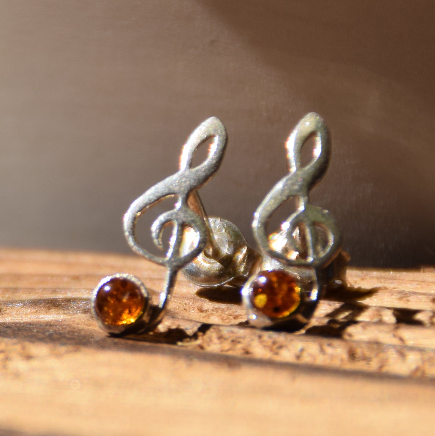 Delicate stud earrings with a musical note in natural cognac amber and 925 Silver, MJ Baltica, BK191