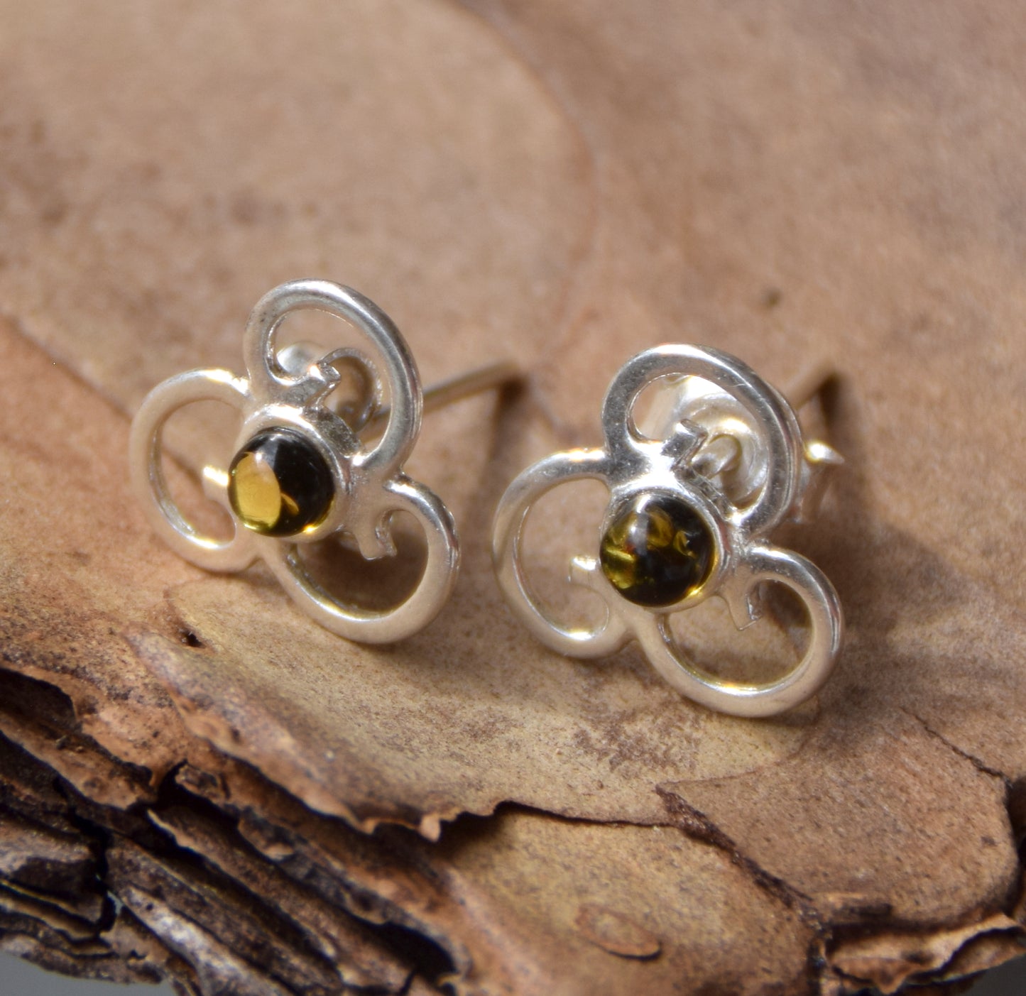 Triskel-shaped earrings crafted with natural green amber and 925 silver, MJ Baltica, BK232