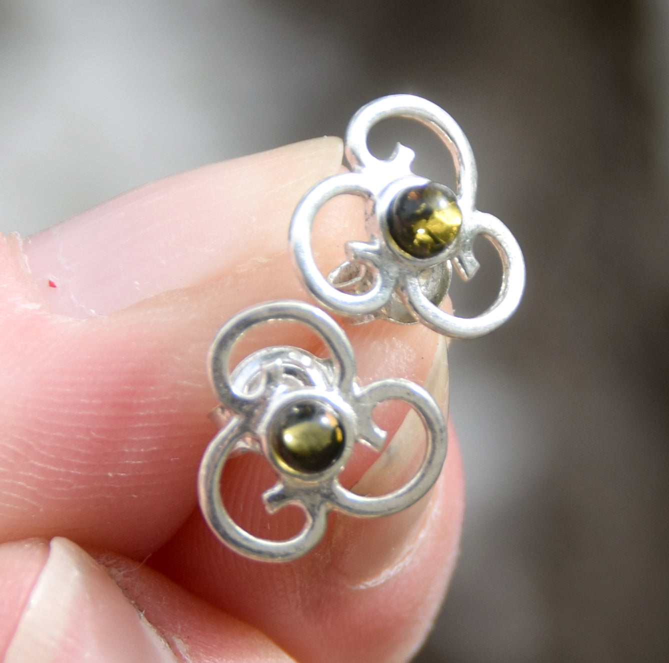Triskel-shaped earrings crafted with natural green amber and 925 silver, MJ Baltica, BK232