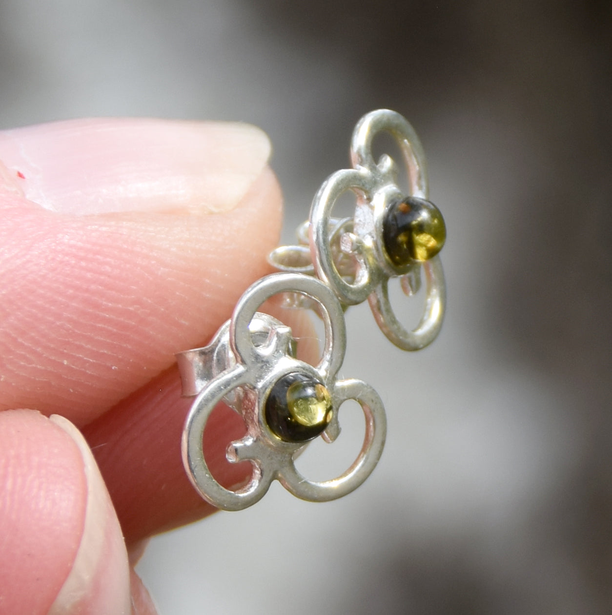 Triskel-shaped earrings crafted with natural green amber and 925 silver, MJ Baltica, BK232