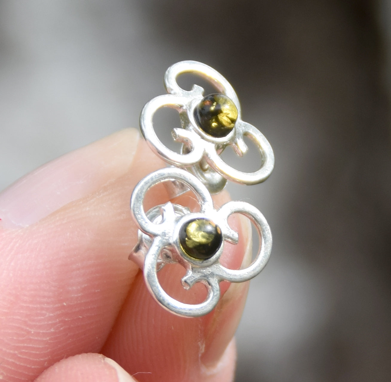 Triskel-shaped earrings crafted with natural green amber and 925 silver, MJ Baltica, BK232