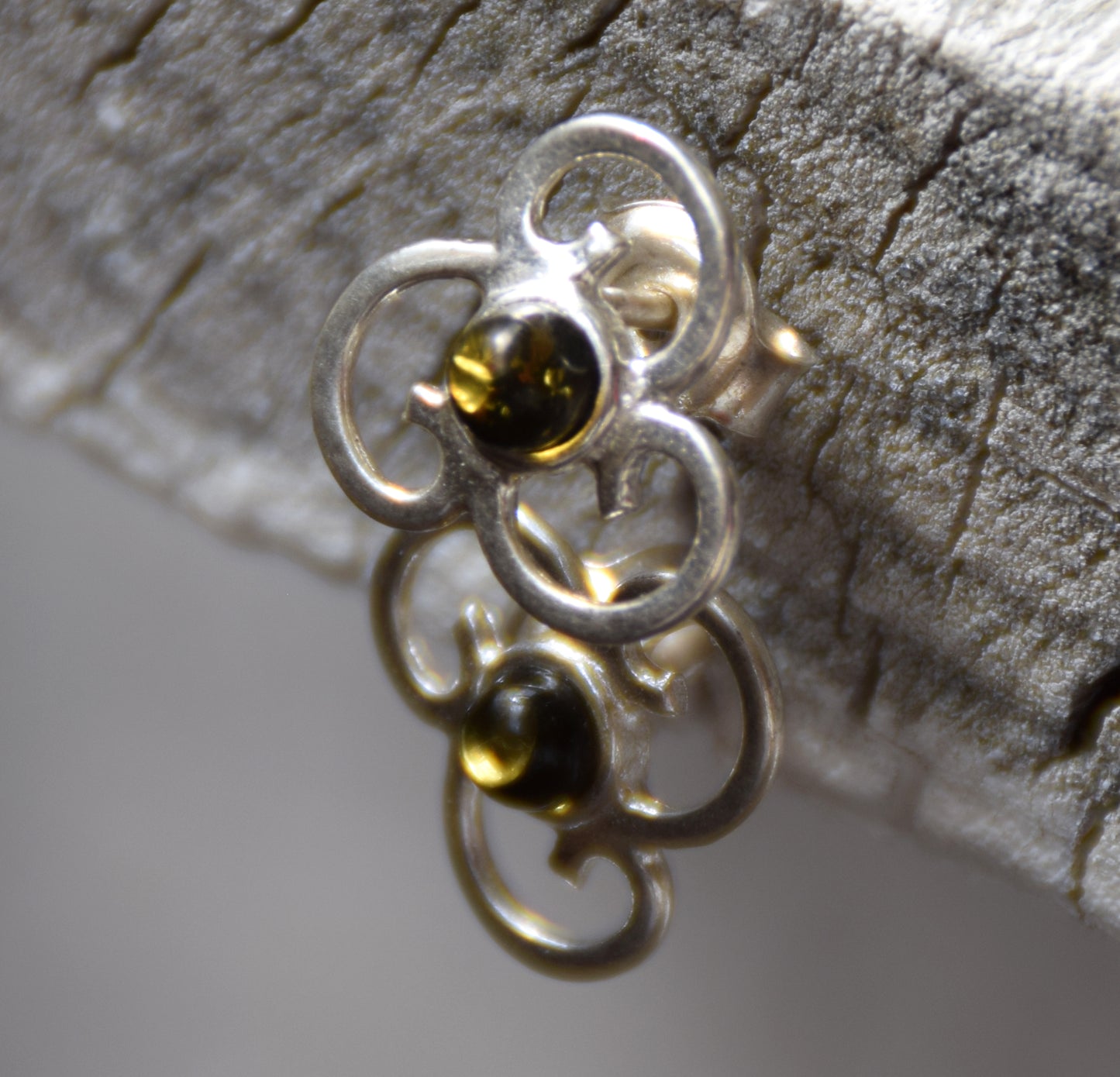 Triskel-shaped earrings crafted with natural green amber and 925 silver, MJ Baltica, BK232