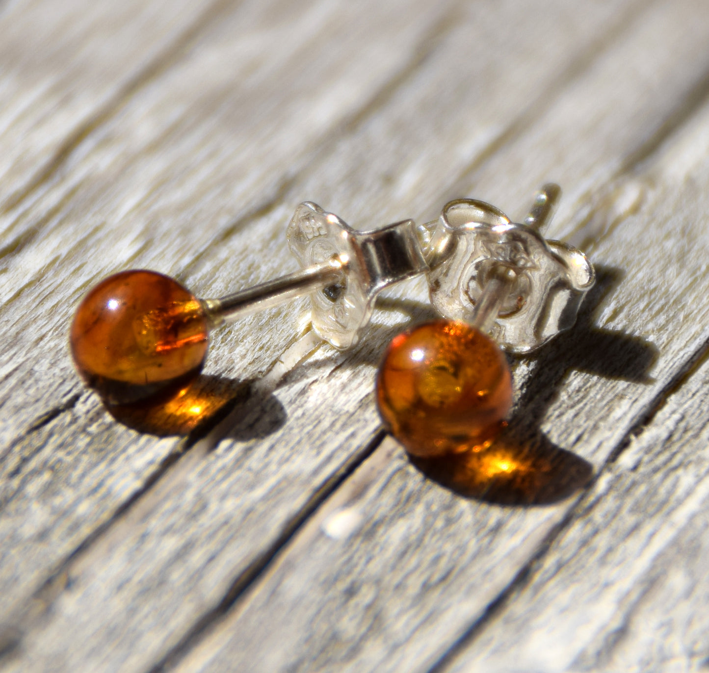 Essential earrings created with natural cognac-colored Amber spheres and 925 Silver, MJ Baltica, BK234