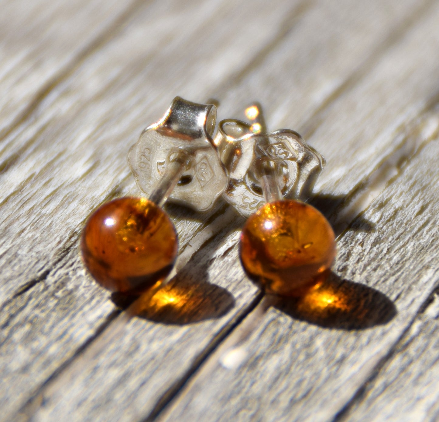 Essential earrings created with natural cognac-colored Amber spheres and 925 Silver, MJ Baltica, BK234