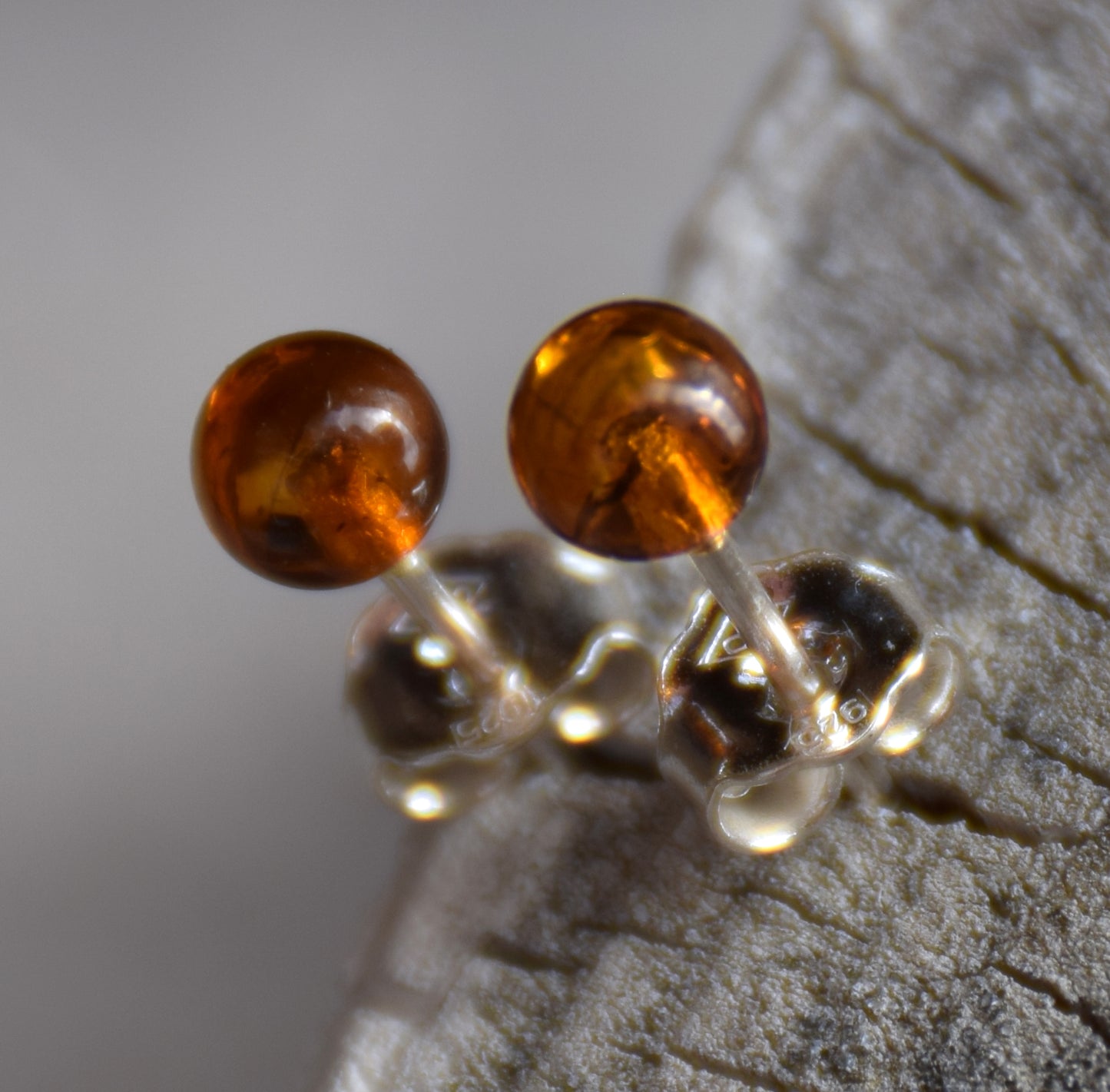 Essential earrings created with natural cognac-colored Amber spheres and 925 Silver, MJ Baltica, BK234