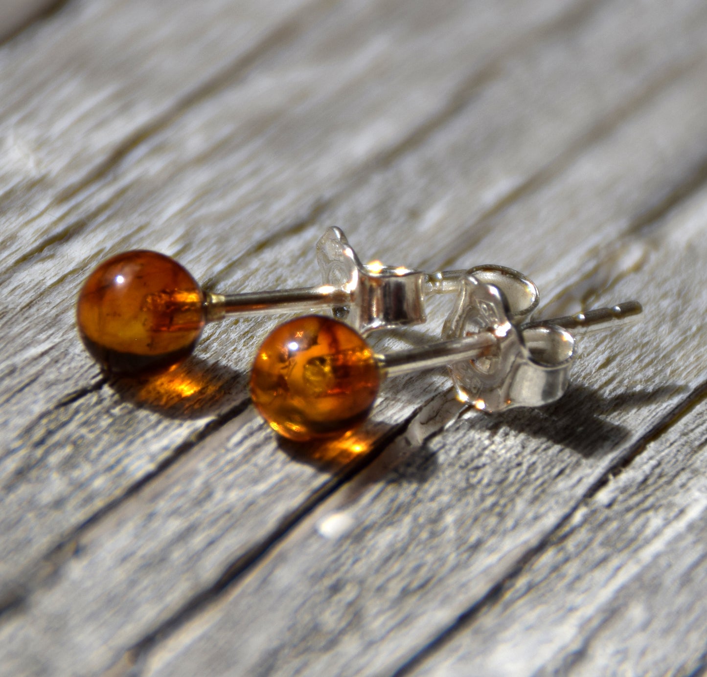 Essential earrings created with natural cognac-colored Amber spheres and 925 Silver, MJ Baltica, BK234