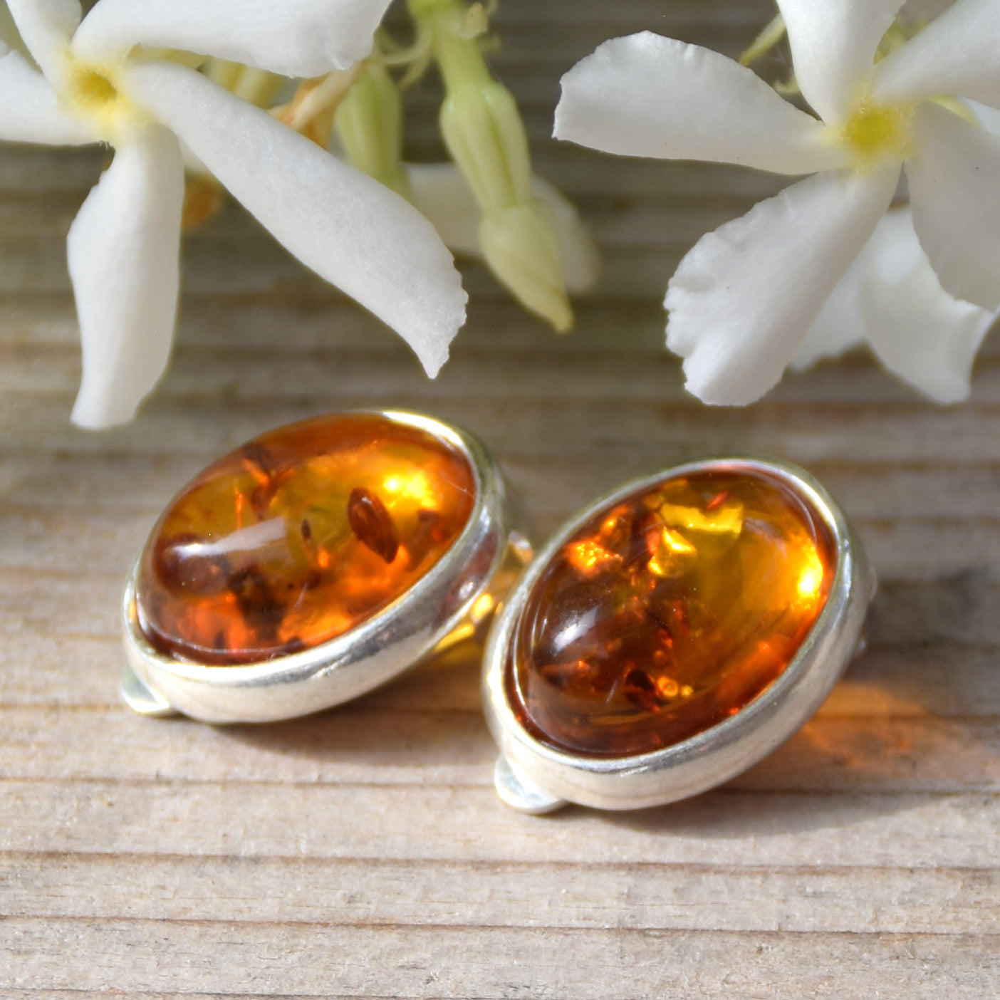 Oval clip-on earrings with natural cognac amber and 925 sterling silver, MJ Baltica, BKK005