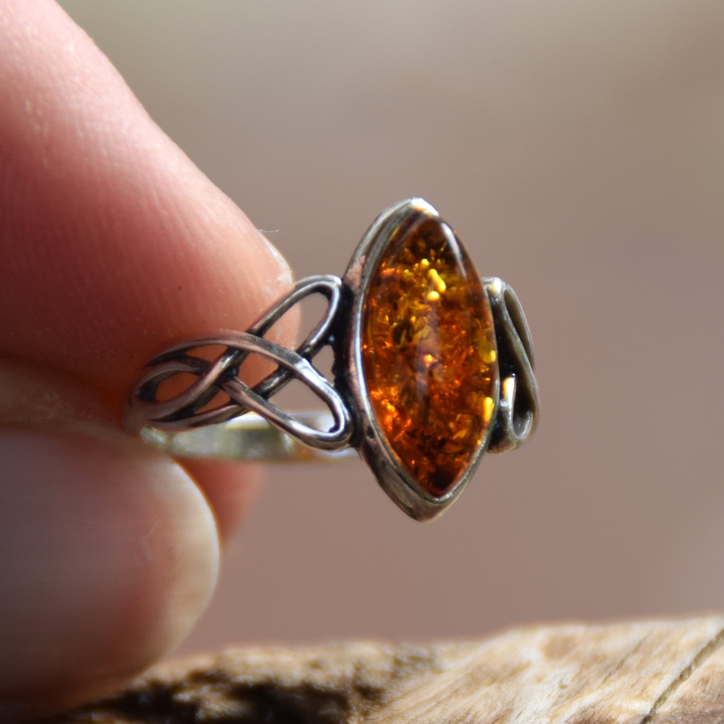 Ring with triskel created in natural cognac-colored Amber and 925 Sterling Silver, MJ Baltica, BP002