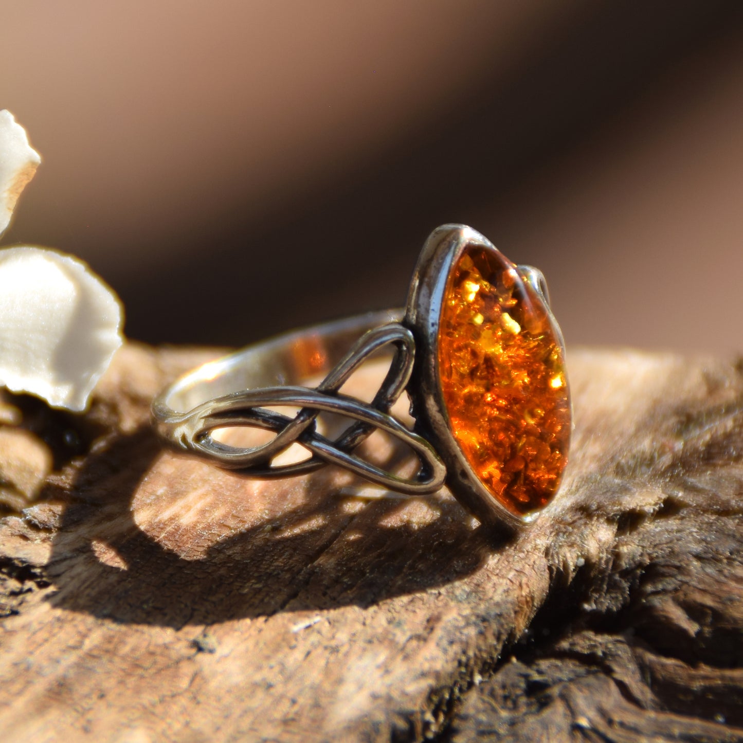 Ring with triskel created in natural cognac-colored Amber and 925 Sterling Silver, MJ Baltica, BP002