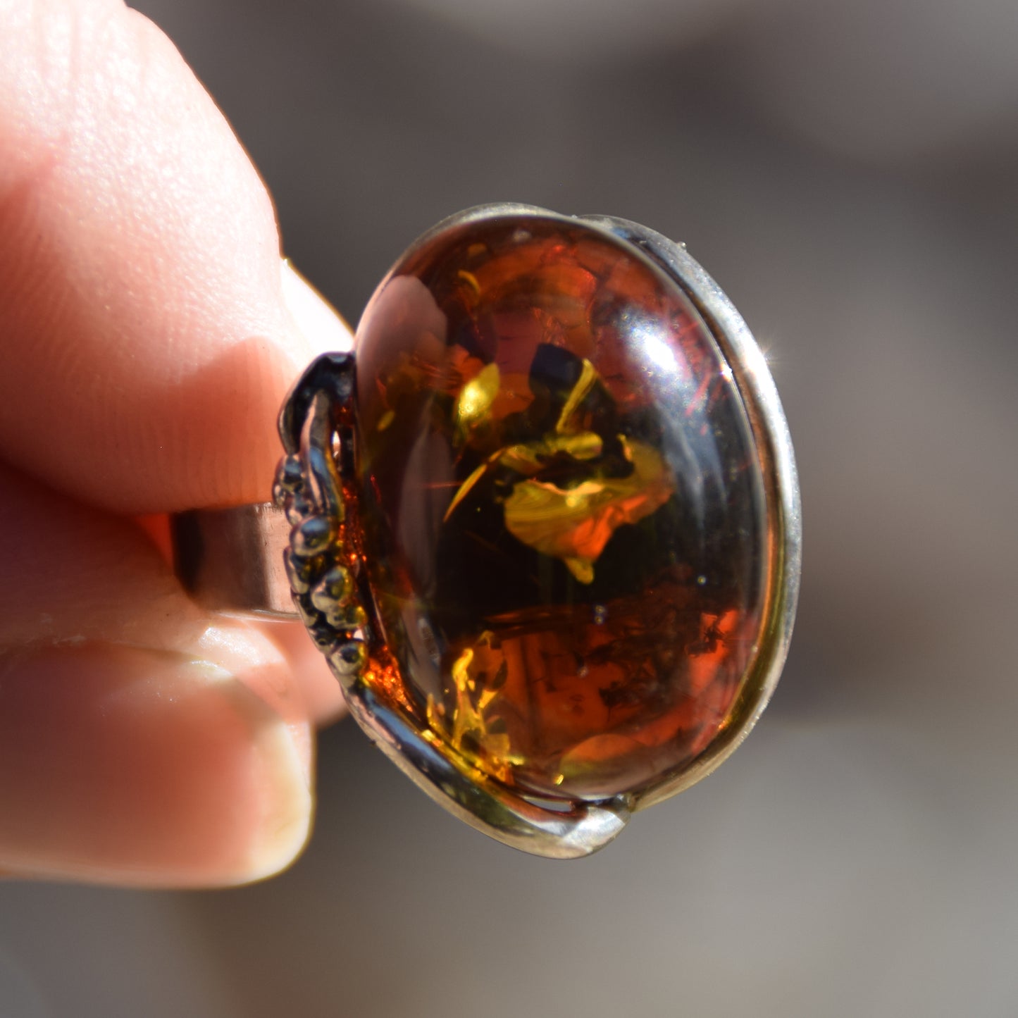 Adjustable ring with a unique natural Amber gemstone in green and brown hues and 925 Silver, MJ Baltica, BP043