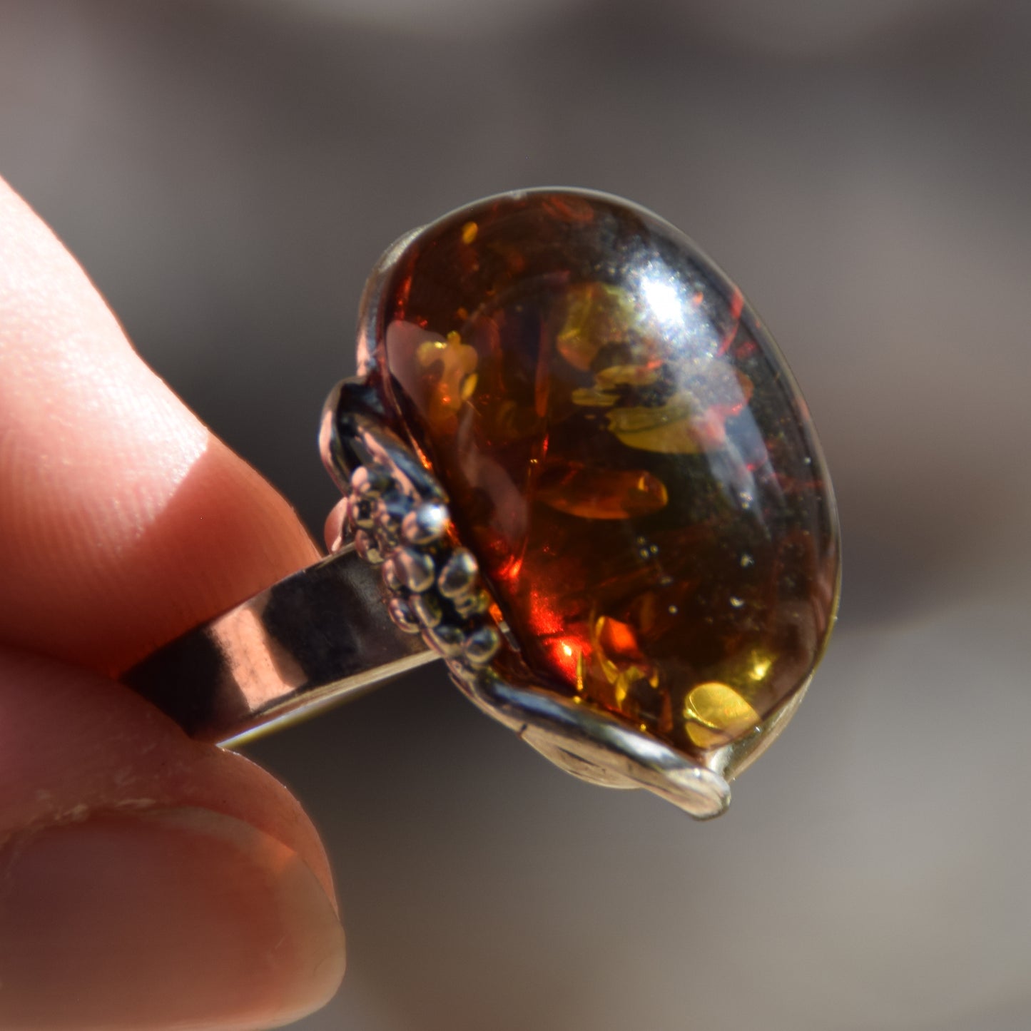 Adjustable ring with a unique natural Amber gemstone in green and brown hues and 925 Silver, MJ Baltica, BP043