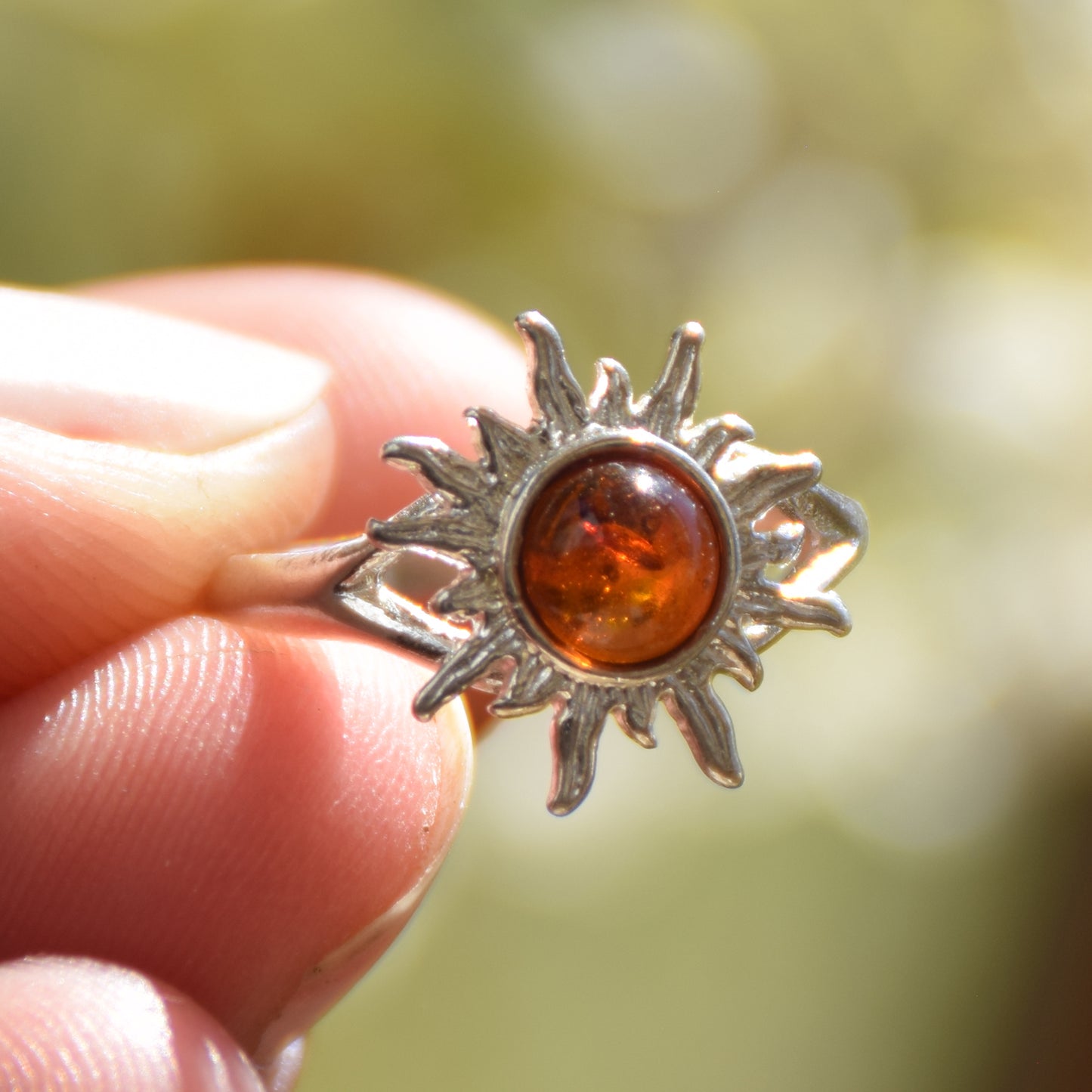 Bright ring with a delicate sun created with cognac-colored natural Amber and 925 Silver, MJ Baltica, BP050