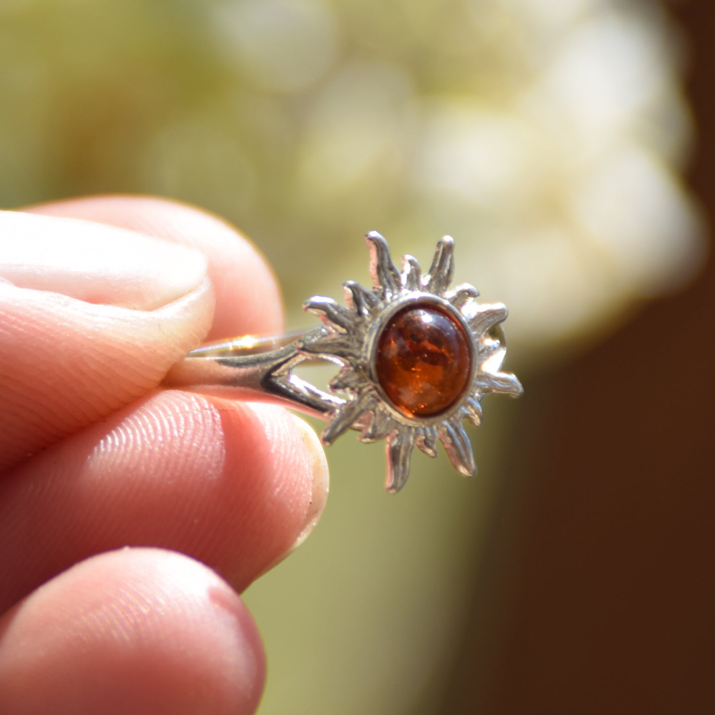 Bright ring with a delicate sun created with cognac-colored natural Amber and 925 Silver, MJ Baltica, BP050