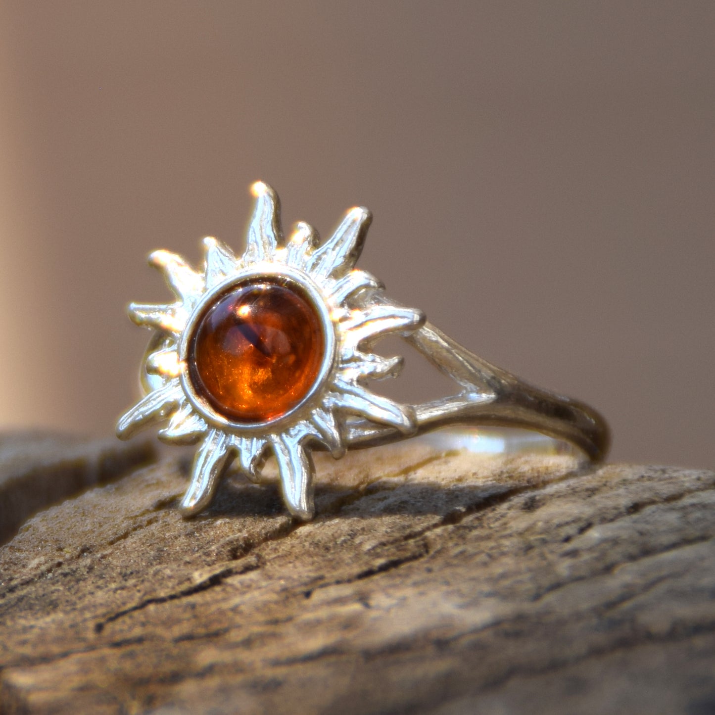 Bright ring with a delicate sun created with cognac-colored natural Amber and 925 Silver, MJ Baltica, BP050