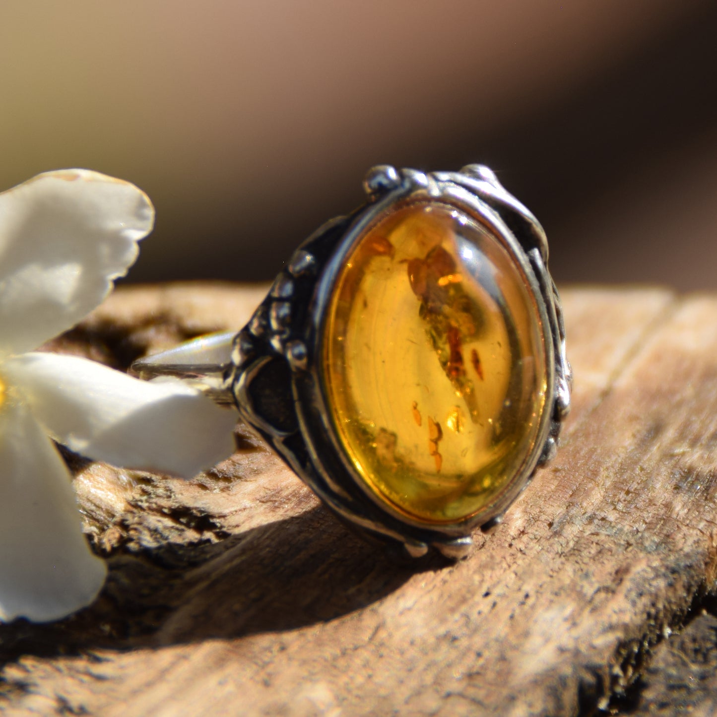 Classic floral design ring crafted with oval cognac natural Amber and 925 Sterling Silver, MJ Baltica, BP084