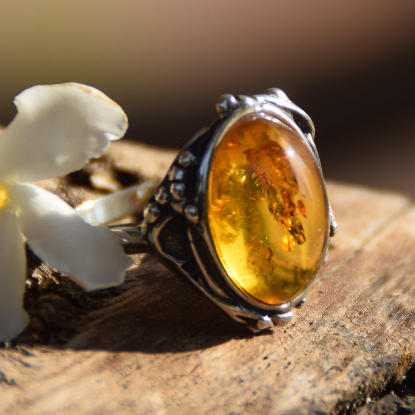 Classic floral design ring crafted with oval cognac natural Amber and 925 Sterling Silver, MJ Baltica, BP084