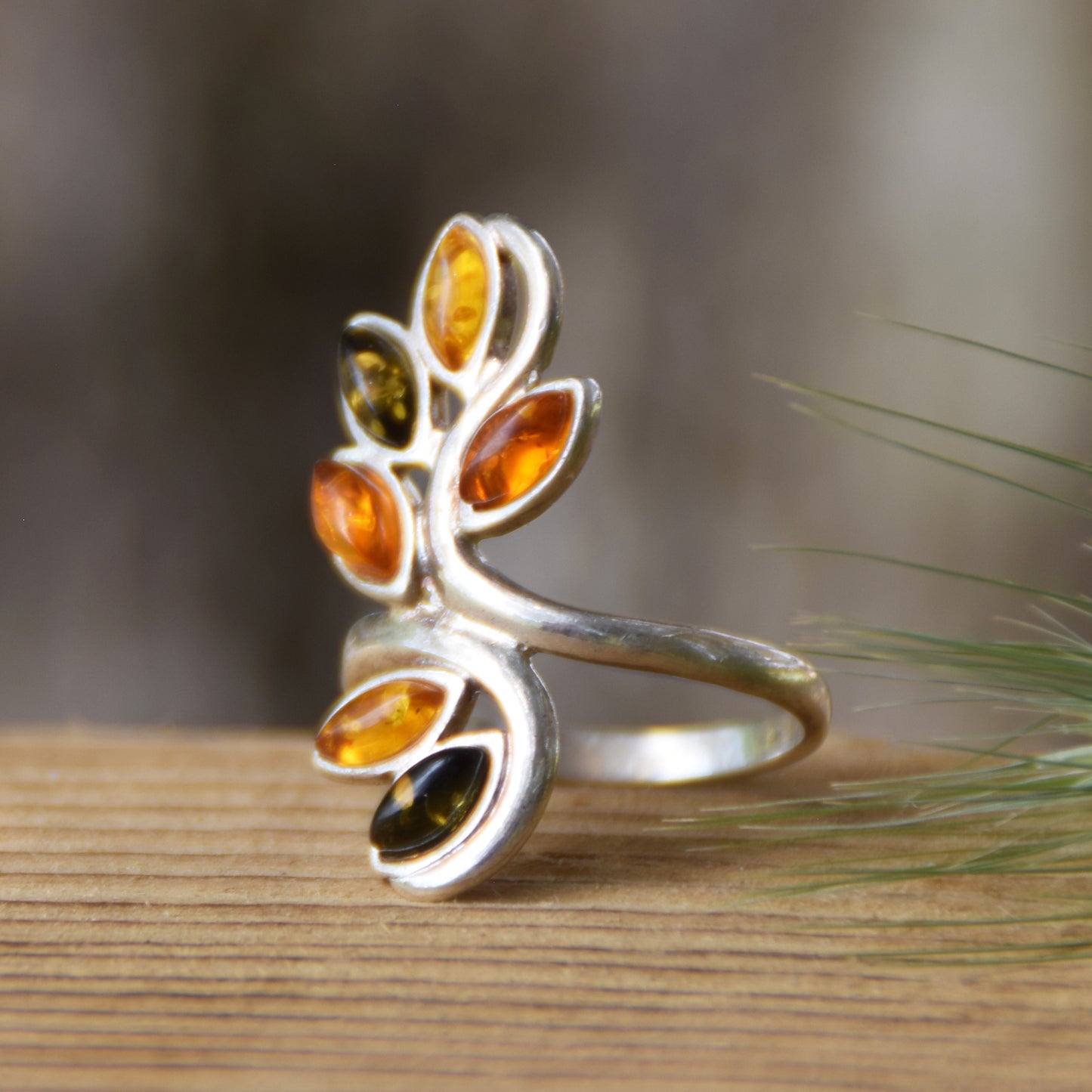 Tall band ring in a floral style created with natural Amber of various shades and 925 Silver, MJ Baltica, BP091