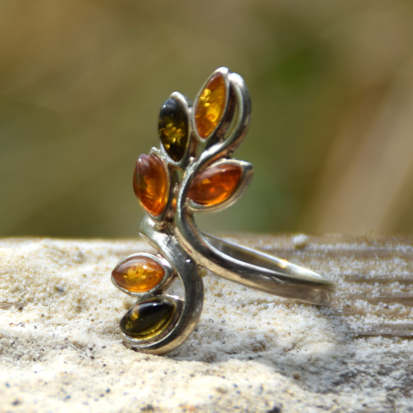 Tall band ring in a floral style created with natural Amber of various shades and 925 Silver, MJ Baltica, BP091