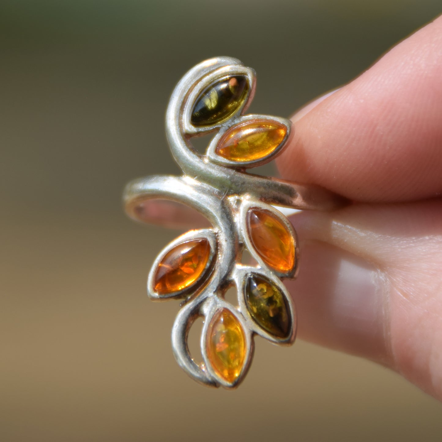 Tall band ring in a floral style created with natural Amber of various shades and 925 Silver, MJ Baltica, BP091