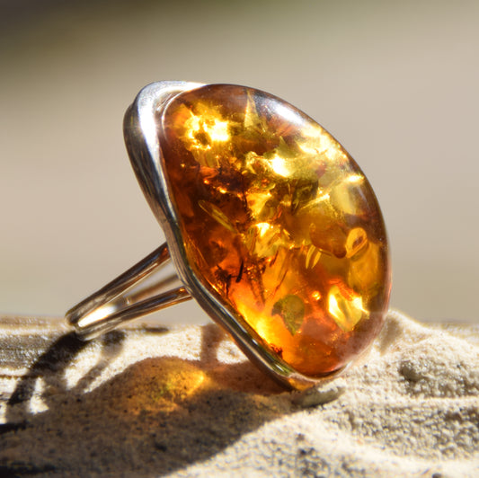 Large adjustable ring with cognac-colored oval natural amber gemstone and 925 Sterling Silver, MJ Baltica, BP108